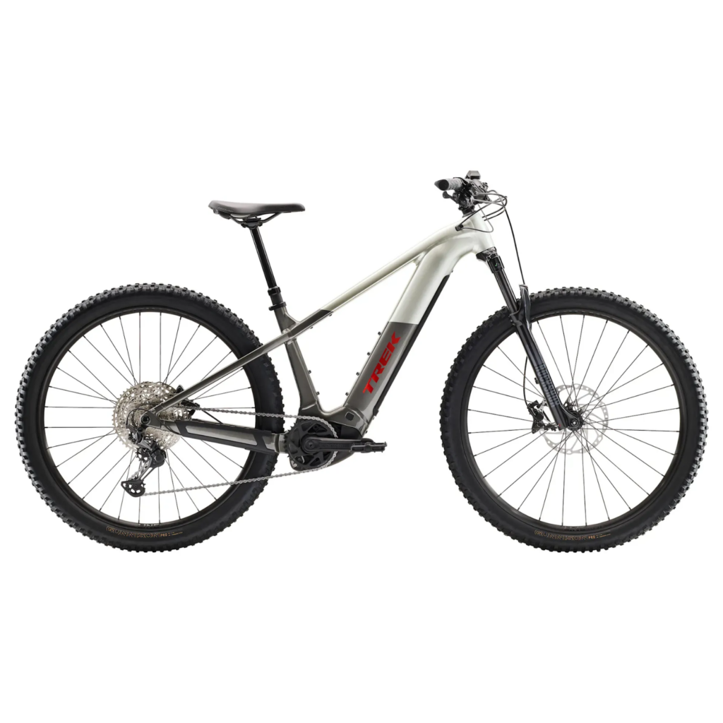 A grey and red Trek Powerfly+6 hardtail electric mountain bike side on